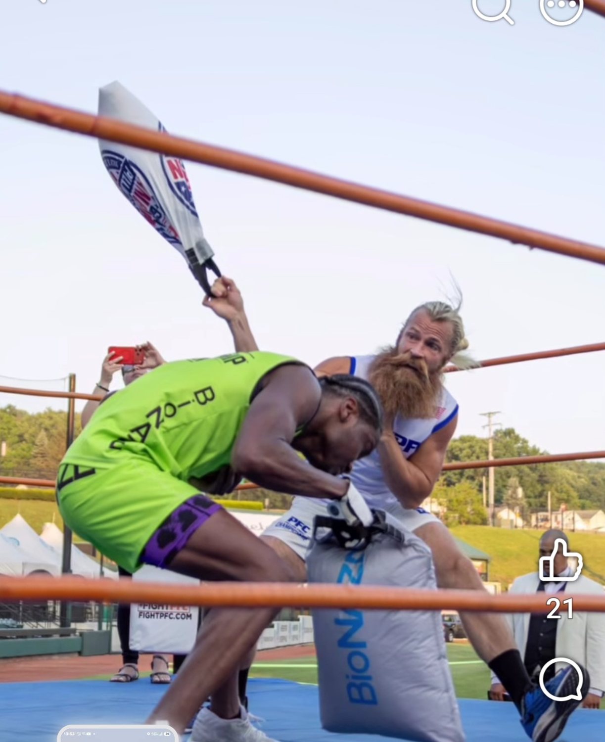 A PFC athlete swings an official competition pillow during a match